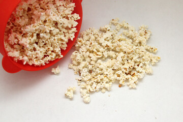 Natural popcorn with natural corn in a container or paper bag ready for a movie
