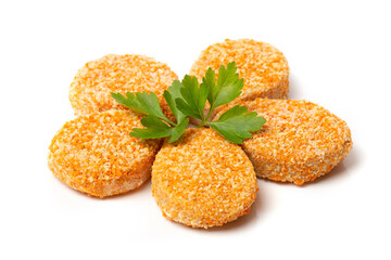 A pile of cooked chicken nuggets isolated on a white background