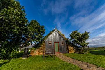 Plakat VÃ­dimyrarkirkja turf and wooden church built in 1834 at summer sunny day in Skagafjordur, north Iceland
