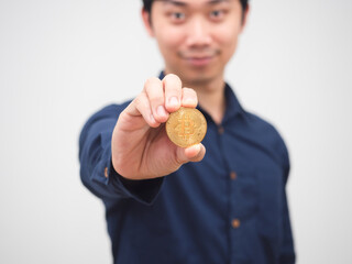 Closeup golden bitcoin in man hand cheerful white background