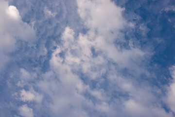 Blue sky  with tiny clouds. Beautiful photo background. wonderful texture.
