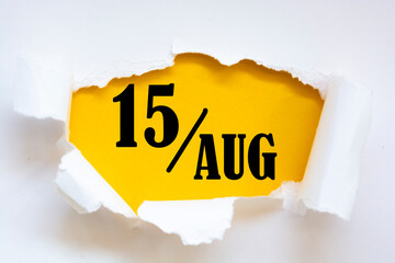 august 15. 15th day of the month, calendar date. Hole in paper with edges torn off. Yellow background is visible through ragged hole. Summer month, day of the year concept. - obrazy, fototapety, plakaty