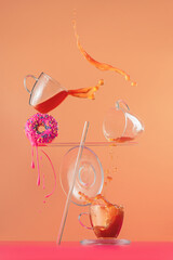 Tea and donut with pink glazing, balancing composition, action still life, splash photography
