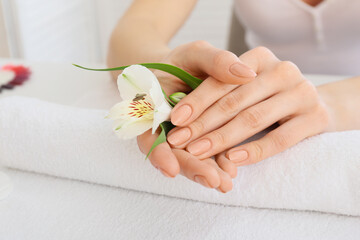 Woman with beautiful manicure in salon