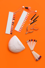 Set of professional tools for manicure on color background