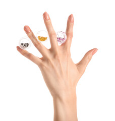 Female hand with beautiful manicure and glitters on white background, closeup