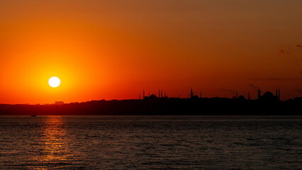 Fototapeta na wymiar Sunset over Istanbul. Siluets mosques of a city