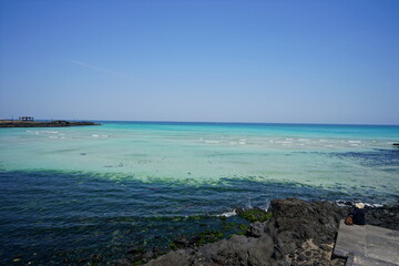 a beautiful seaside landscape with clear bluish water