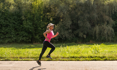 young fitness woman runner athlete running at road