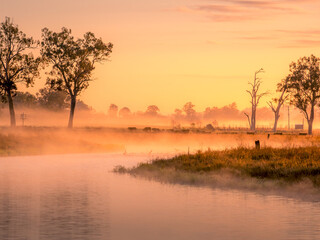 Fototapeta na wymiar Misty River Sunrise