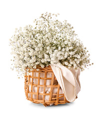 Wicker basket with beautiful flowers on white background