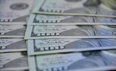 One hundred US dollar bills as background