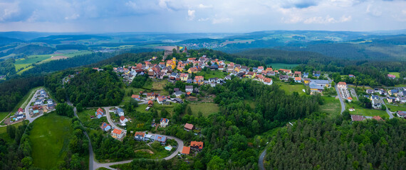 Aerial view of the village Leuchtenberg in Germany, on a cloudy day in Spring