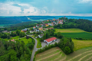 Aerial view of the village Leuchtenberg in Germany, on a cloudy day in Spring