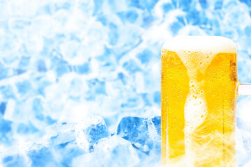 Image of a mug of beer with ice background and dripping foam.