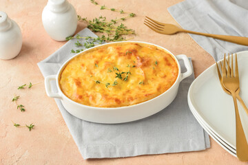 Composition with mashed potato casserole on color background