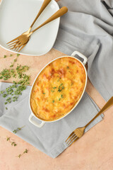 Composition with mashed potato casserole on color background