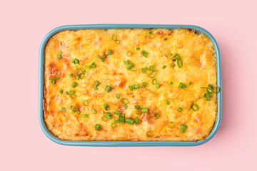 Casserole with mashed potatoes on color background