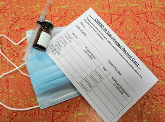 Coronavirus vaccination record card. The concept of defeating Covid-19