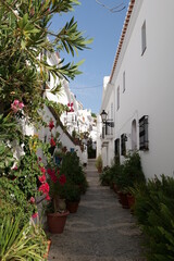 view of a street in Frigiliana, pueblo blanco, typical spanish village architecture in southern part of the country