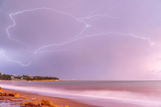 Crawler lightning over Nightcliff Jetty at sunrise with pink sky