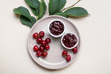 Composition with tasty cherry jam on color background