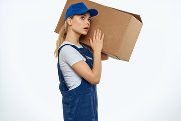 woman in working blue uniform with box in hands delivery service work