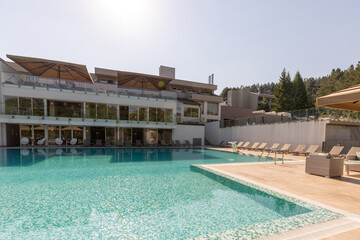 Fototapeta na wymiar Outdoor swimming pool in a modern hotel