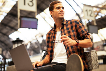 Man shopping online with laptop. Young man buying online with credit card.