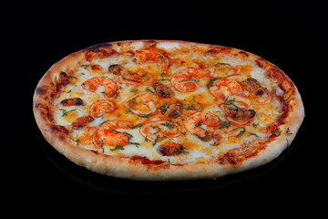 Pizza with shrimps and musselson a wooden background