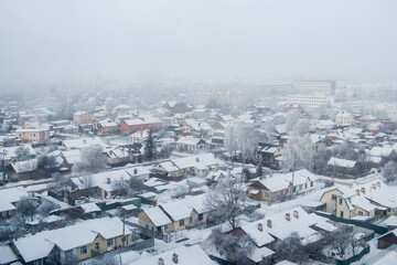 Top view of the winter city. Foggy city view