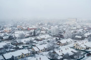 Foto op Canvas Top view of the winter city. Foggy city view © polly