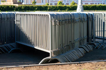 a large number of mobile metal fences on the street