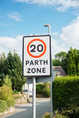 Urban 20 miles per hour speed limit sign in Welsh and English language part of the Welsh government plan to reduce speed limits in residential areas