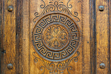beautiful carving on the front door made of solid wood