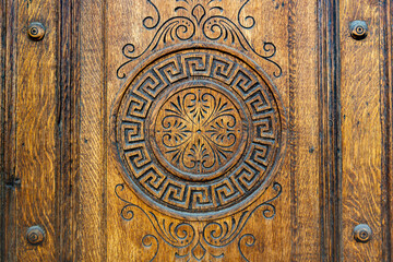 beautiful carving on the front door made of solid wood