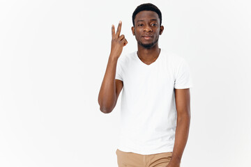 handsome african-looking man in t-shirt gesturing with hands lifestyle