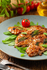 Saltimbocca. Veal schnitzel with sage and Parma ham. Italian specialty. Front view.