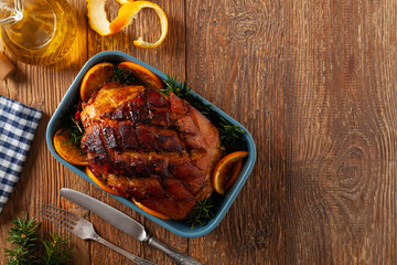 Whole baked ham. Cut thick skin. Marinated in oranges and honey. Top view.
