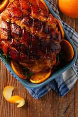 Whole baked ham. Cut thick skin. Marinated in oranges and honey. Top view.