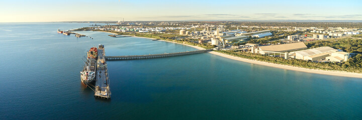 horizontal shot of Kwinana bulk jetty with large ship docked at the port