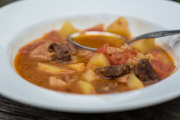 Traditional easter european goulash soup with beef meat and vegetables