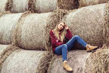 Naklejka na ściany i meble Woman outdoor portrait. Blondie beauty girl in autumn haystacks