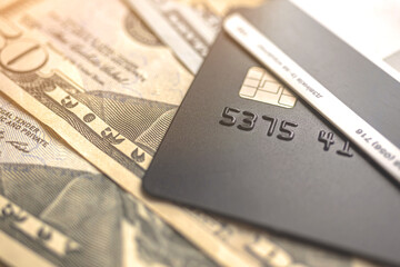 Credit cards and money dollar on background, macro photo with selective focus, finance concept