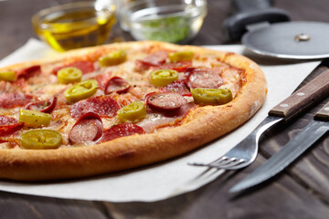 tasty pizza on the wooden background