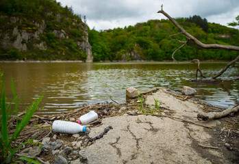 Discarded garbage and plastics along the river banks of the Loire Valley cause environmental...