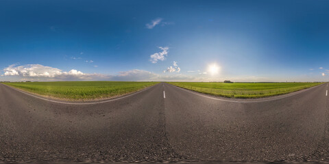 full seamless spherical hdri panorama 360 degrees angle view on no traffic asphalt road among field in sunny evening and clear blue sky with clouds in equirectangular projection, VR AR virtual reality