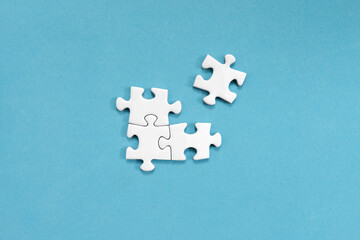 White jigsaw puzzles, on blue background