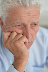 Portrait of a sad senior man thinking