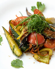Pickled and fried vegetables with herbs on white background. Autumn salad. Close-up shot. Soft focus.
